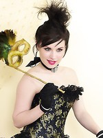 Heavenly brunette model in corset and black seamed stockings teases you.