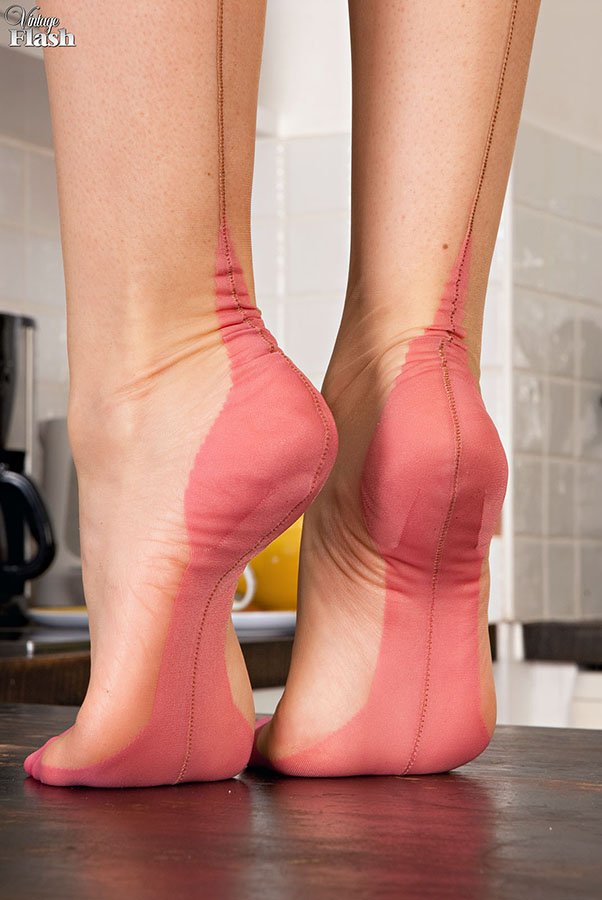 British girl in retro nylons and girdles